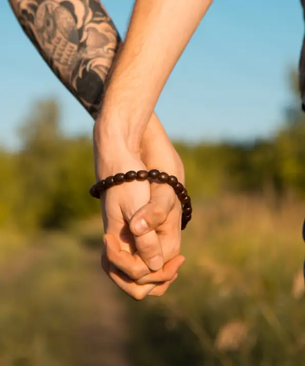 Image of two men Holding hands at gay Wedding