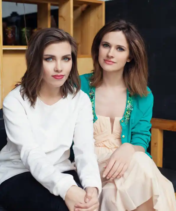 happy young women sitting indoor lifestyle portrait